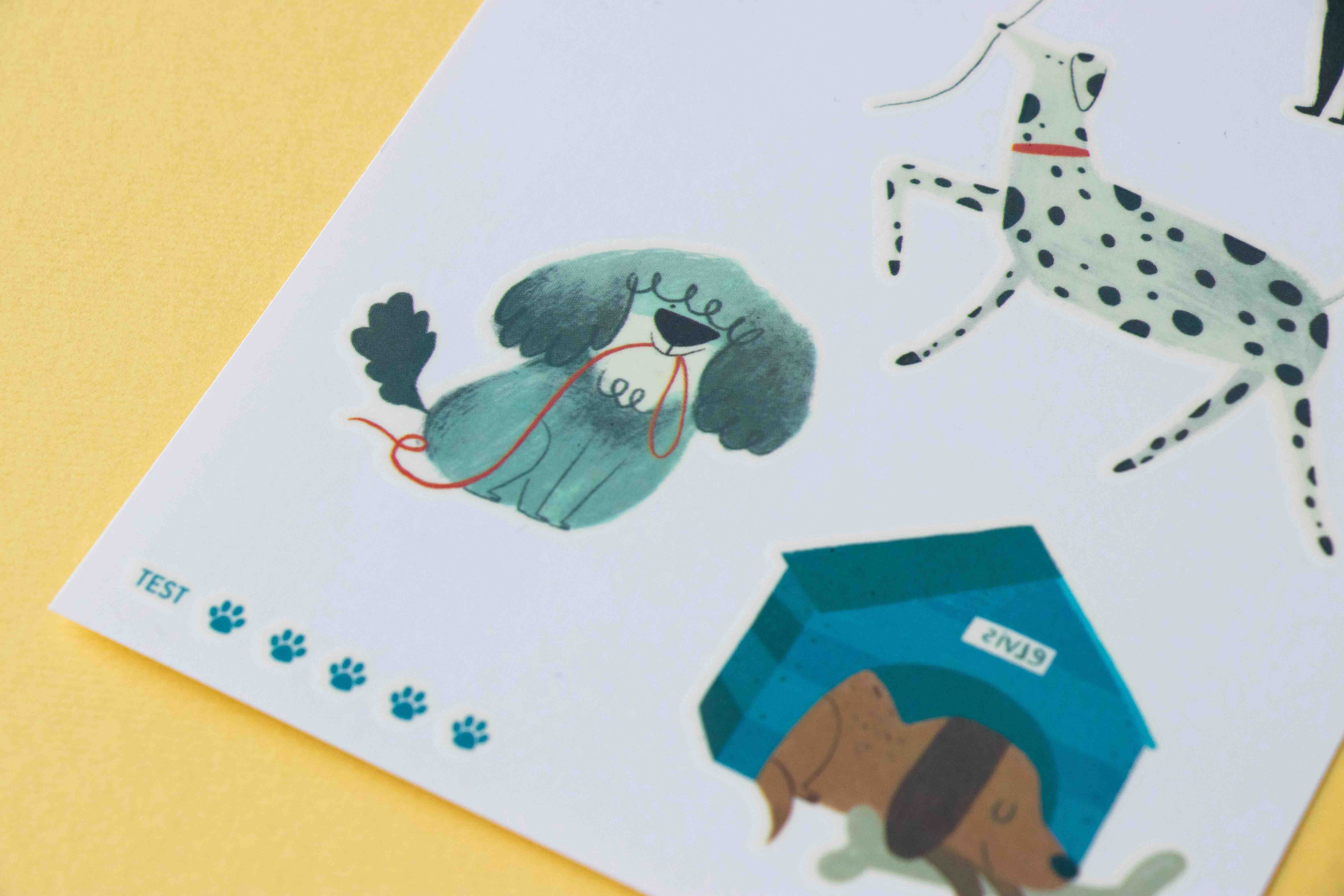 Londji illustrations of dogs tattoos on a piece of paper with a yellow background