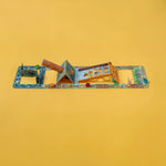 Londji family game with various pieces on a yellow background