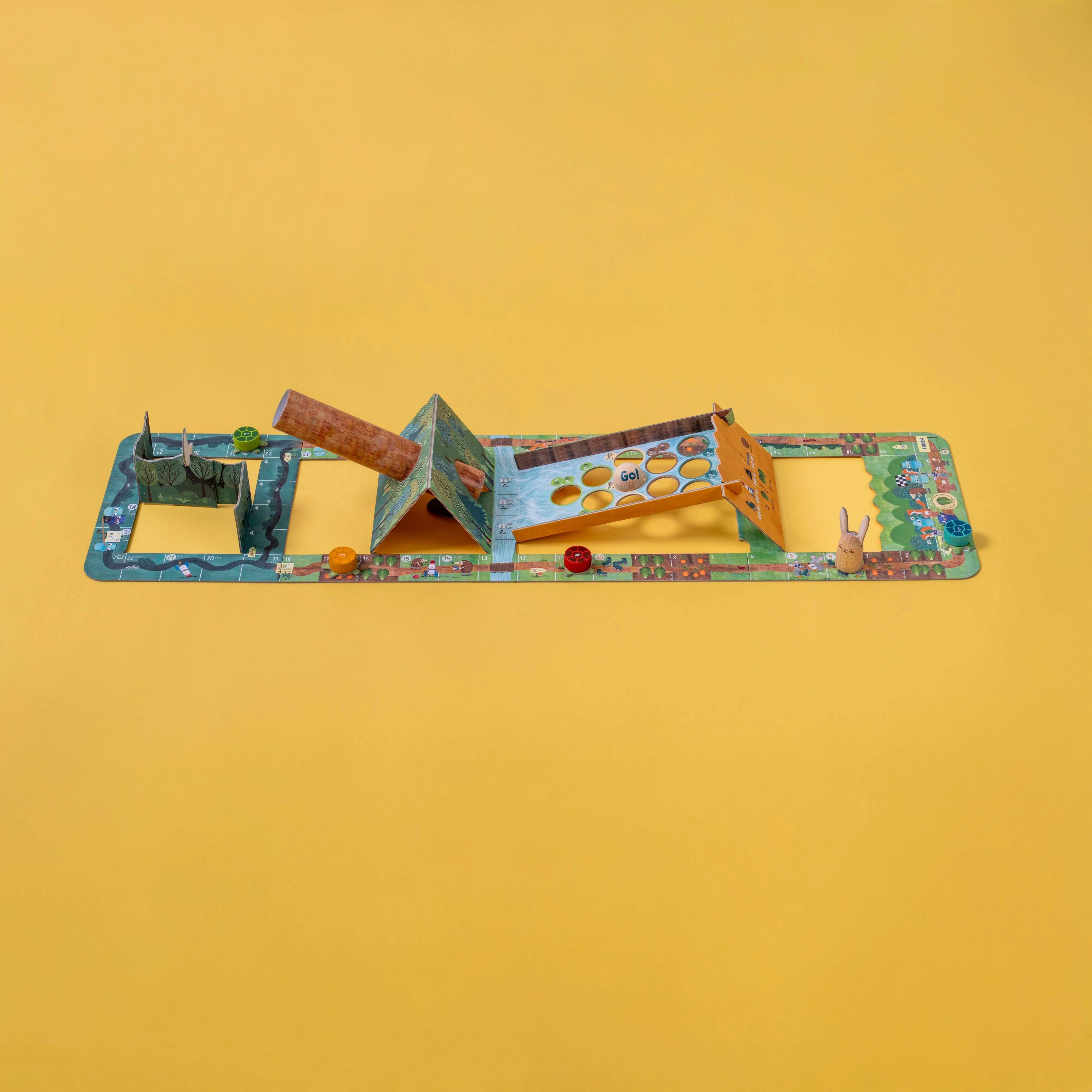 Londji family game with various pieces on a yellow background
