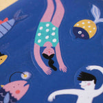 Londji stickers - illustration of a person diving into water with various sea creatures on a blue background