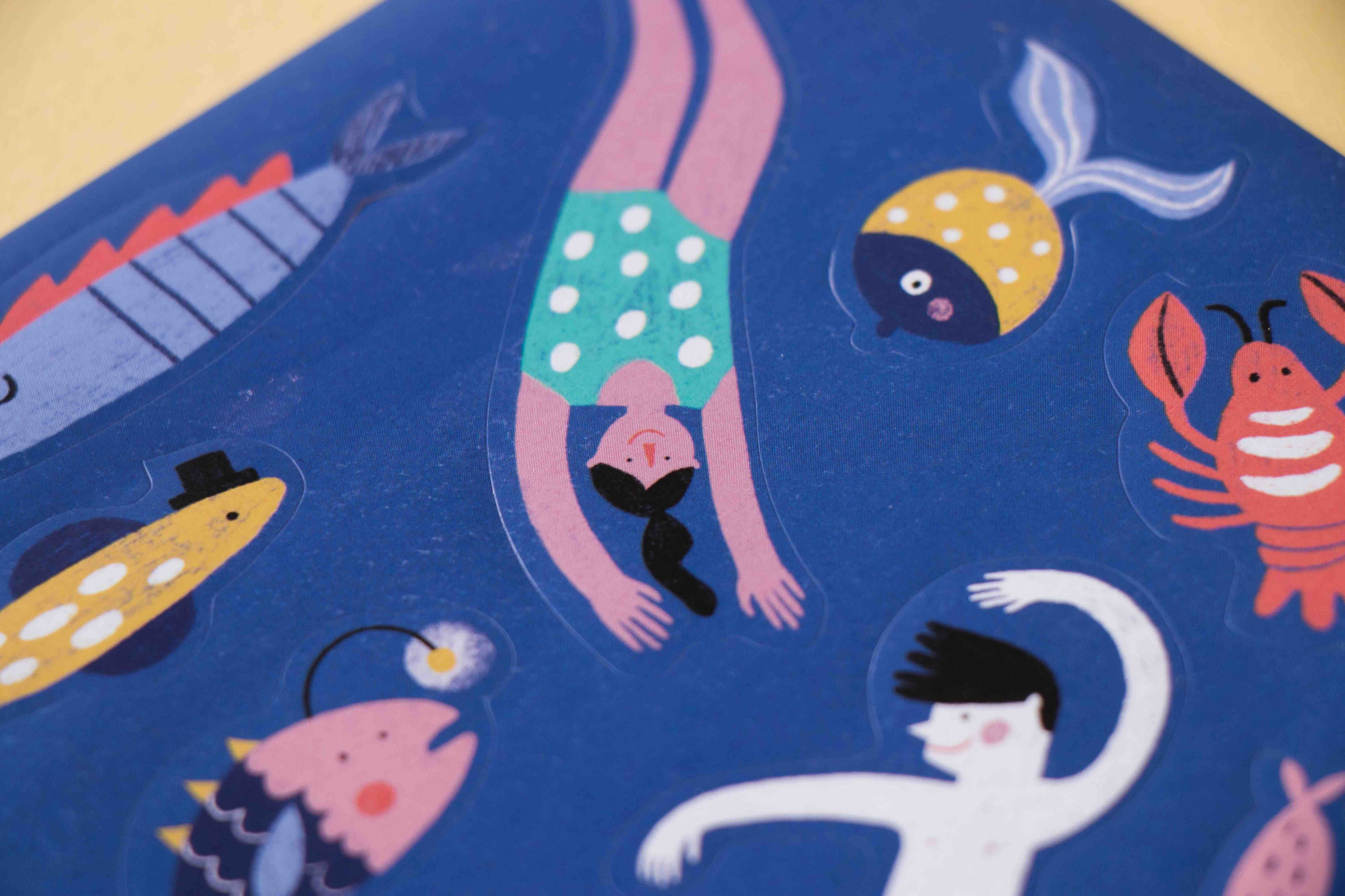 Londji stickers - illustration of a person diving into water with various sea creatures on a blue background