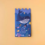 Londji pack of stickers with a whale illustration on a gradient background