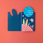 Londji illustrated space-themed cover on a red background
