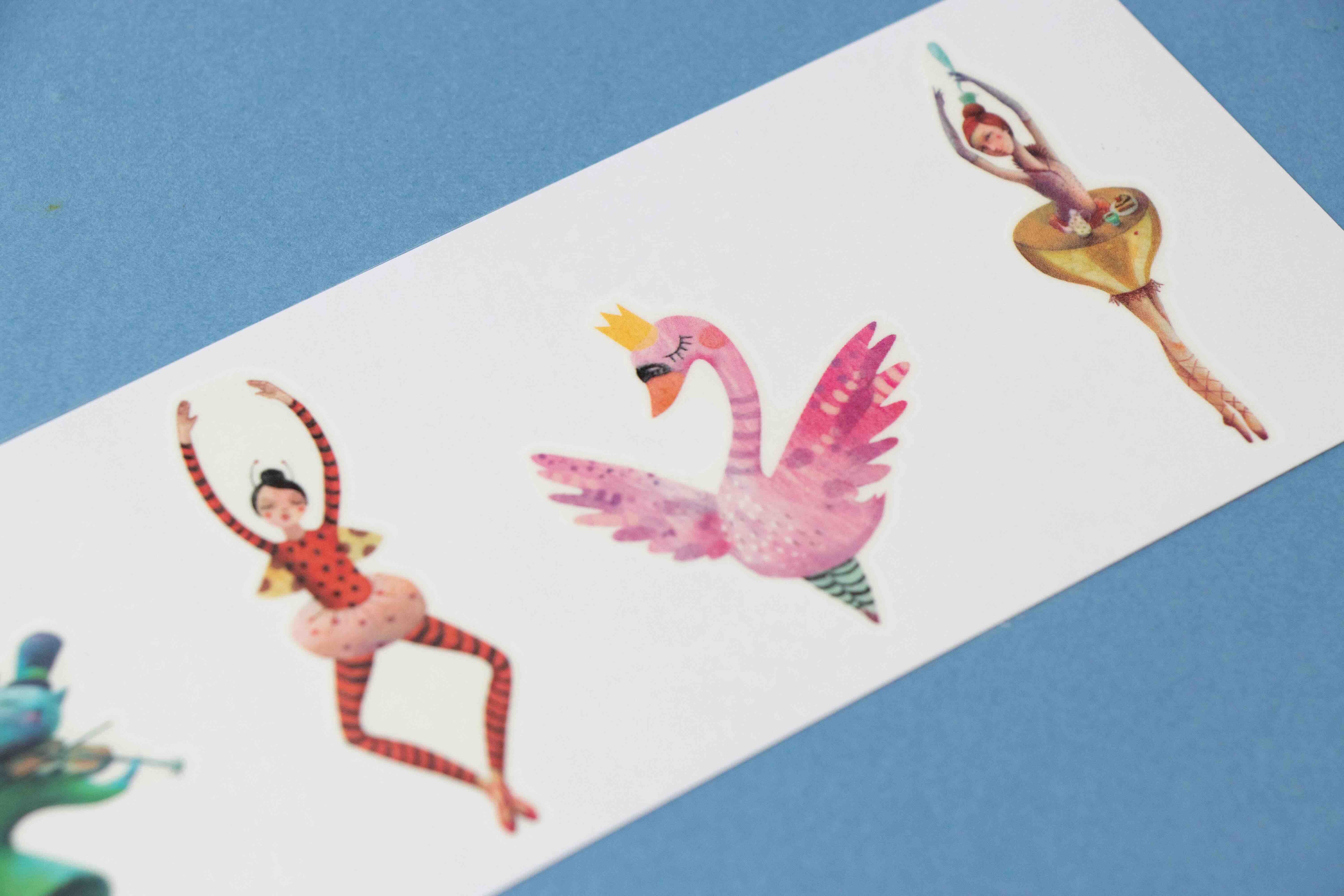 Londji colorful temporary tattoos of a flamingo and a ballerina on a white card with a blue background.