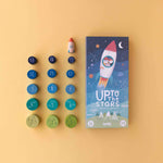 Londji wooden game packaging titled 'Up to the Stars' with colorful game pieces on a yellow background