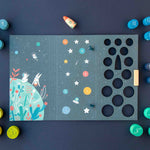 Londji children's educational board game with colorful pieces on a dark blue background