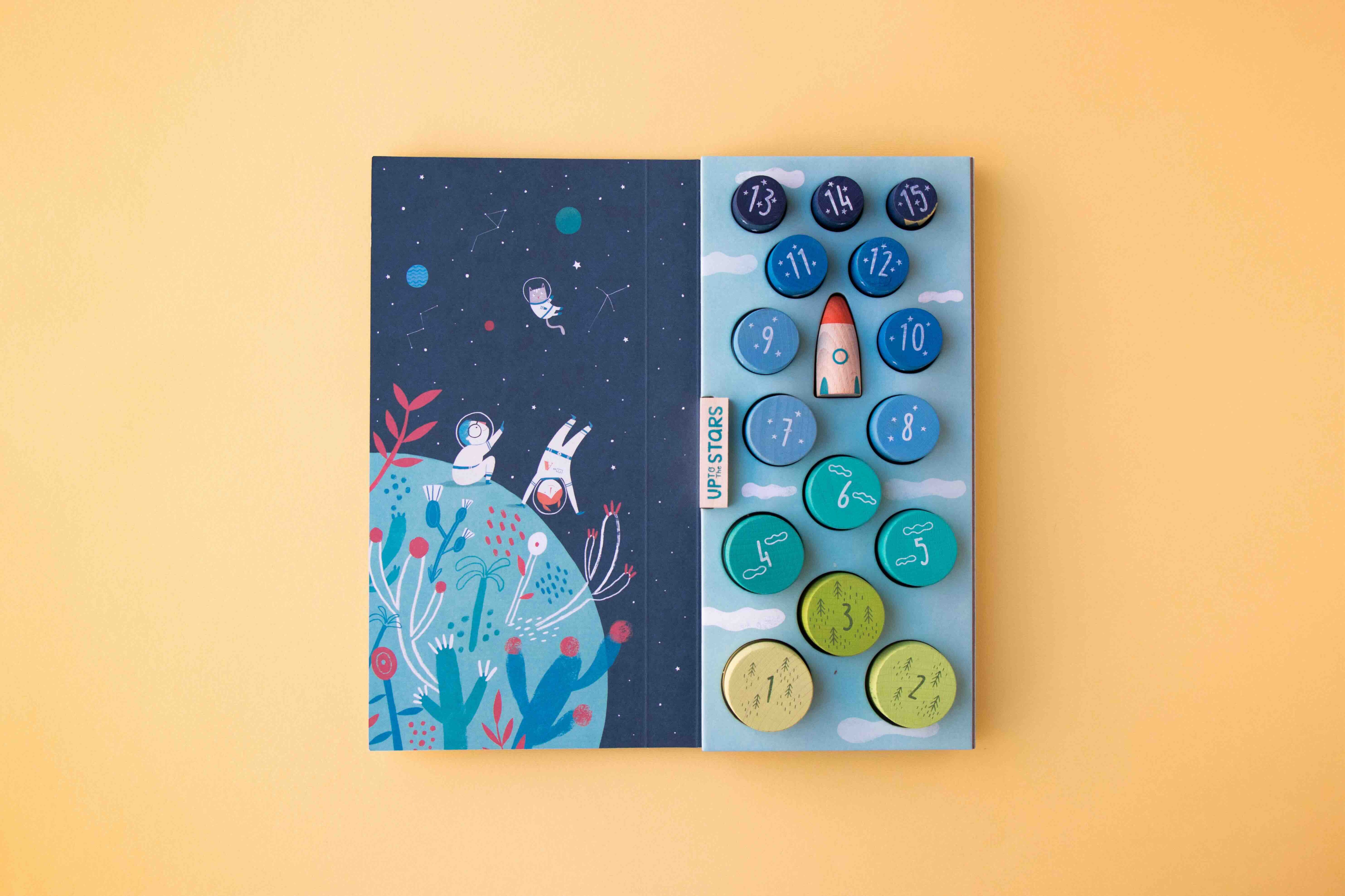 Londji stacking game with space-themed illustration and colorful buttons on a yellow background