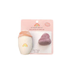 Baby pacifier and bottle set packaging with rainbow design on a white background