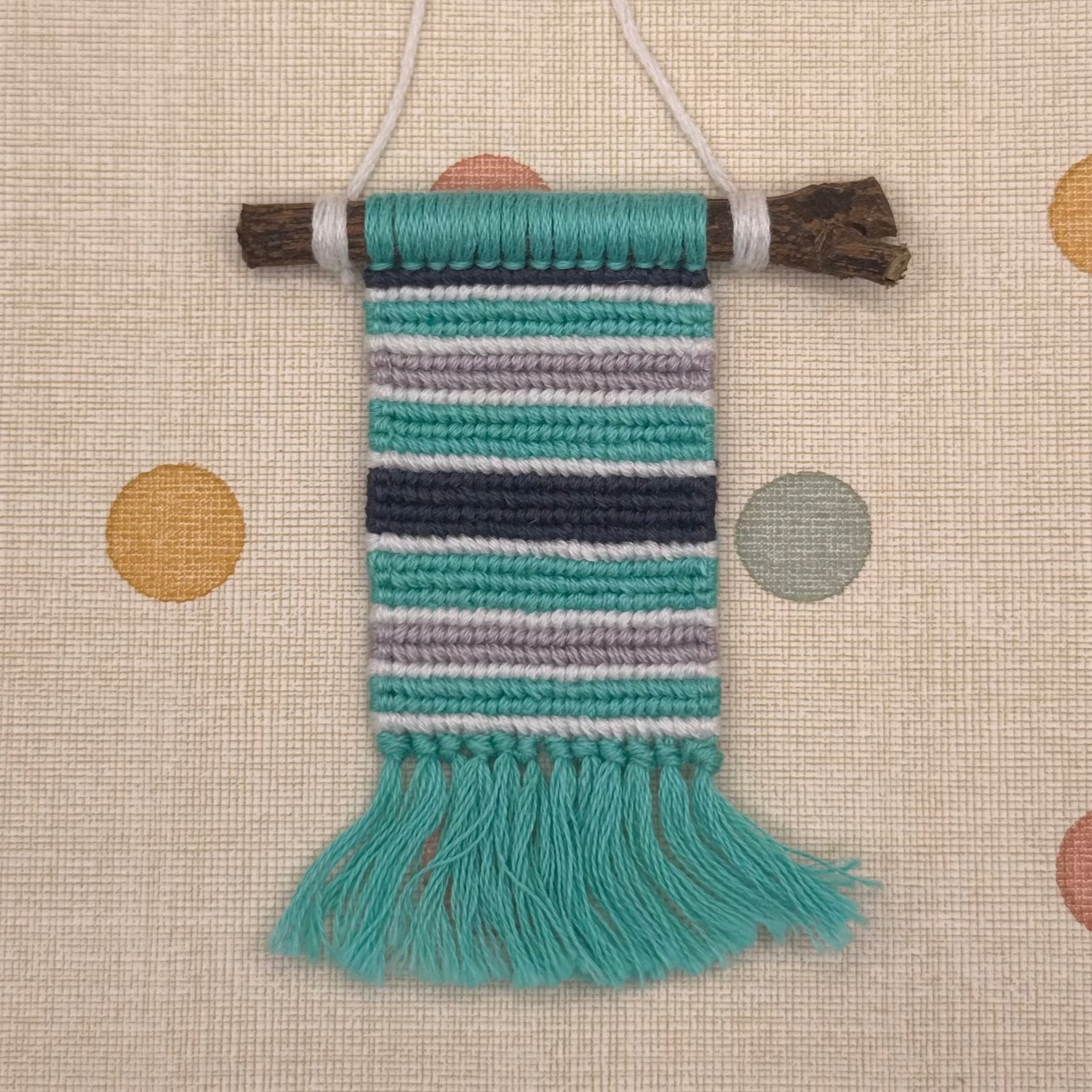 Woven decorative item with colorful stripes