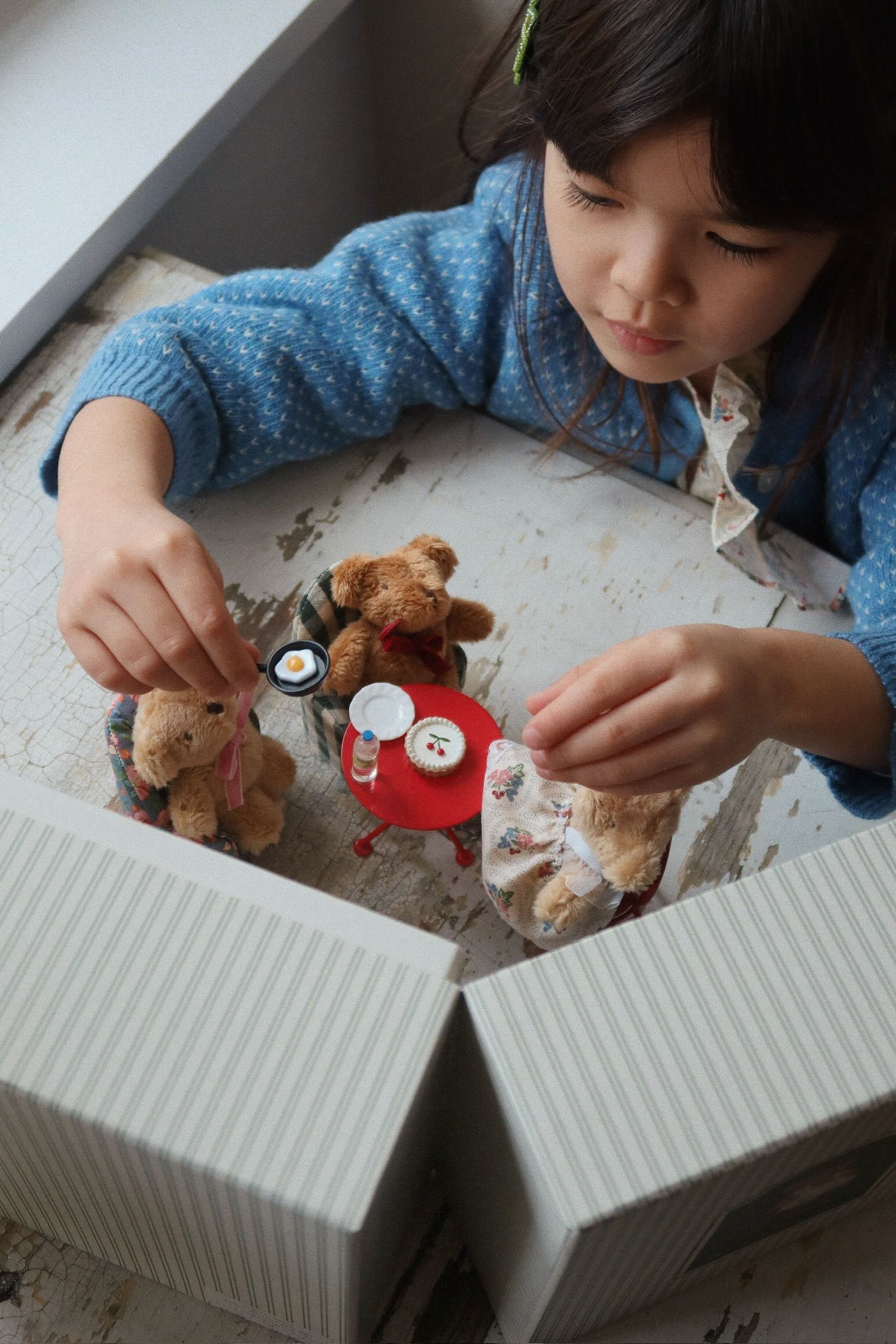 Child playing with Konges Sløjd My Tiny Kitchen