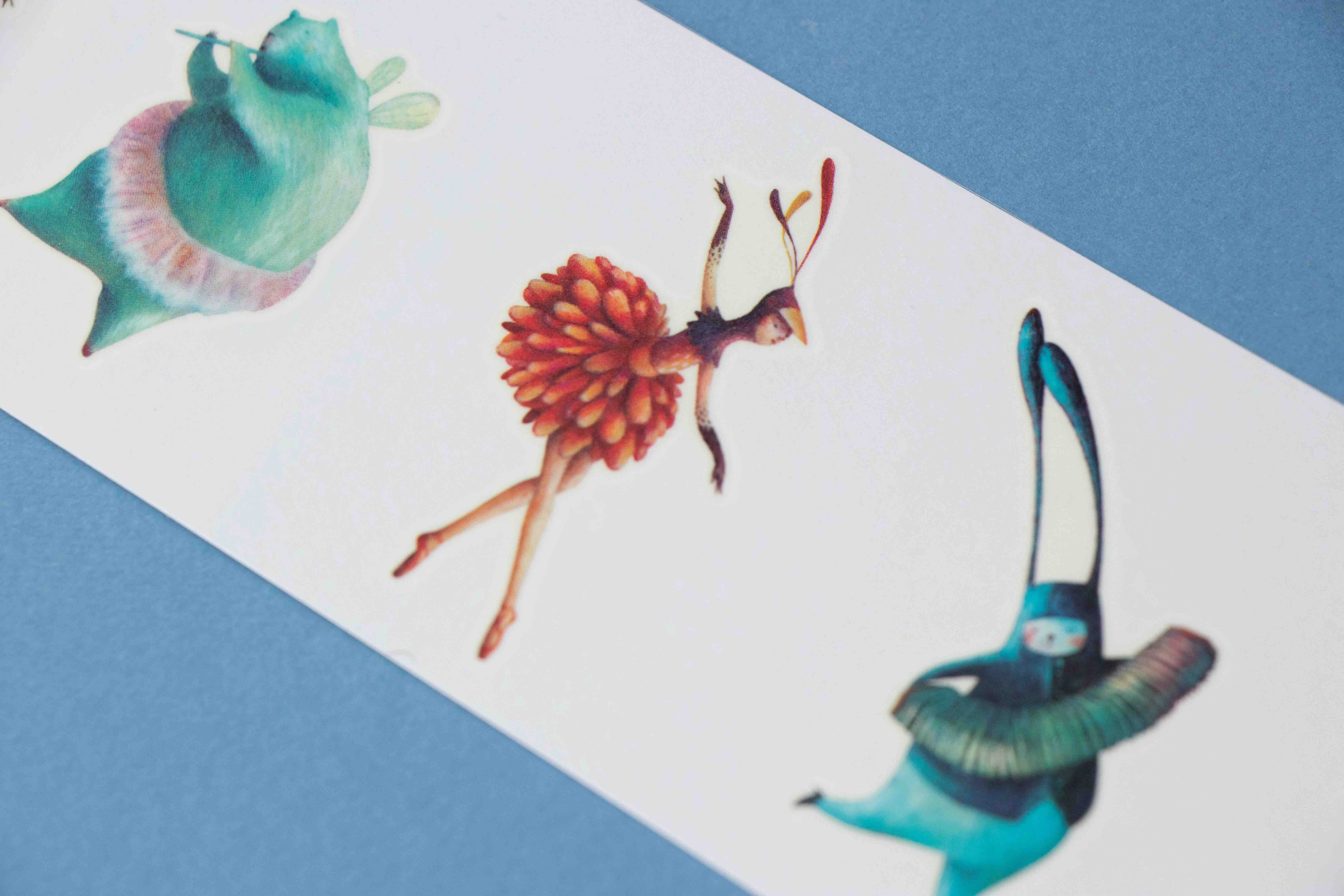 Londji colorful ballerina illustration tattoos on a blue and white striped background