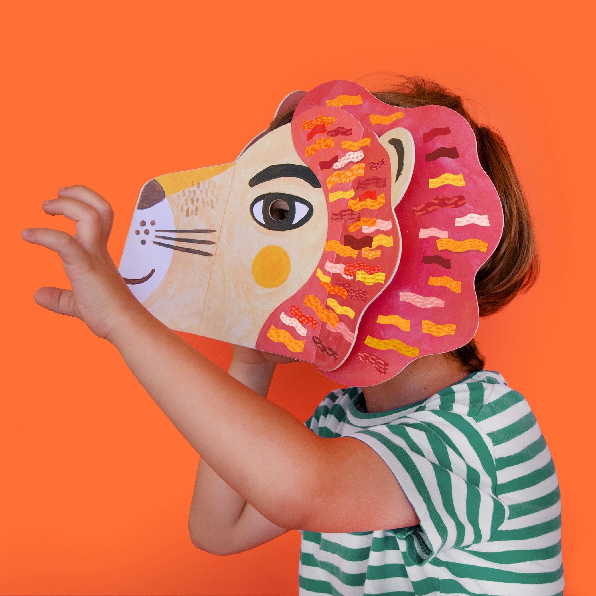 Londji person wearing a colorful animal mask against an orange background