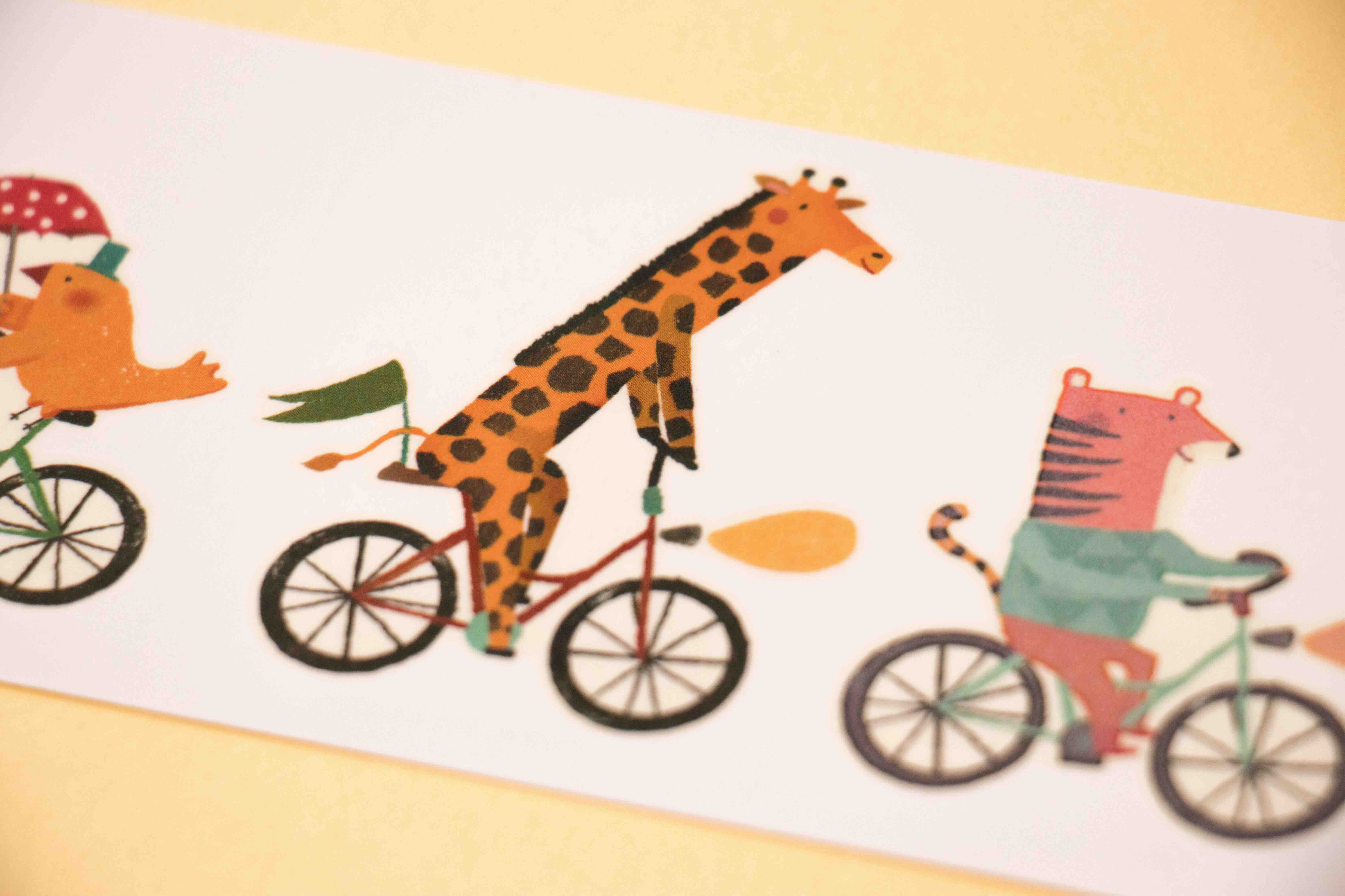 Londji tattoo illustration of animals riding bicycles on a white background