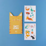 Londji yellow cat-shaped case with tattoos, and two sheets of cat-themed temporary tattoos on a blue background