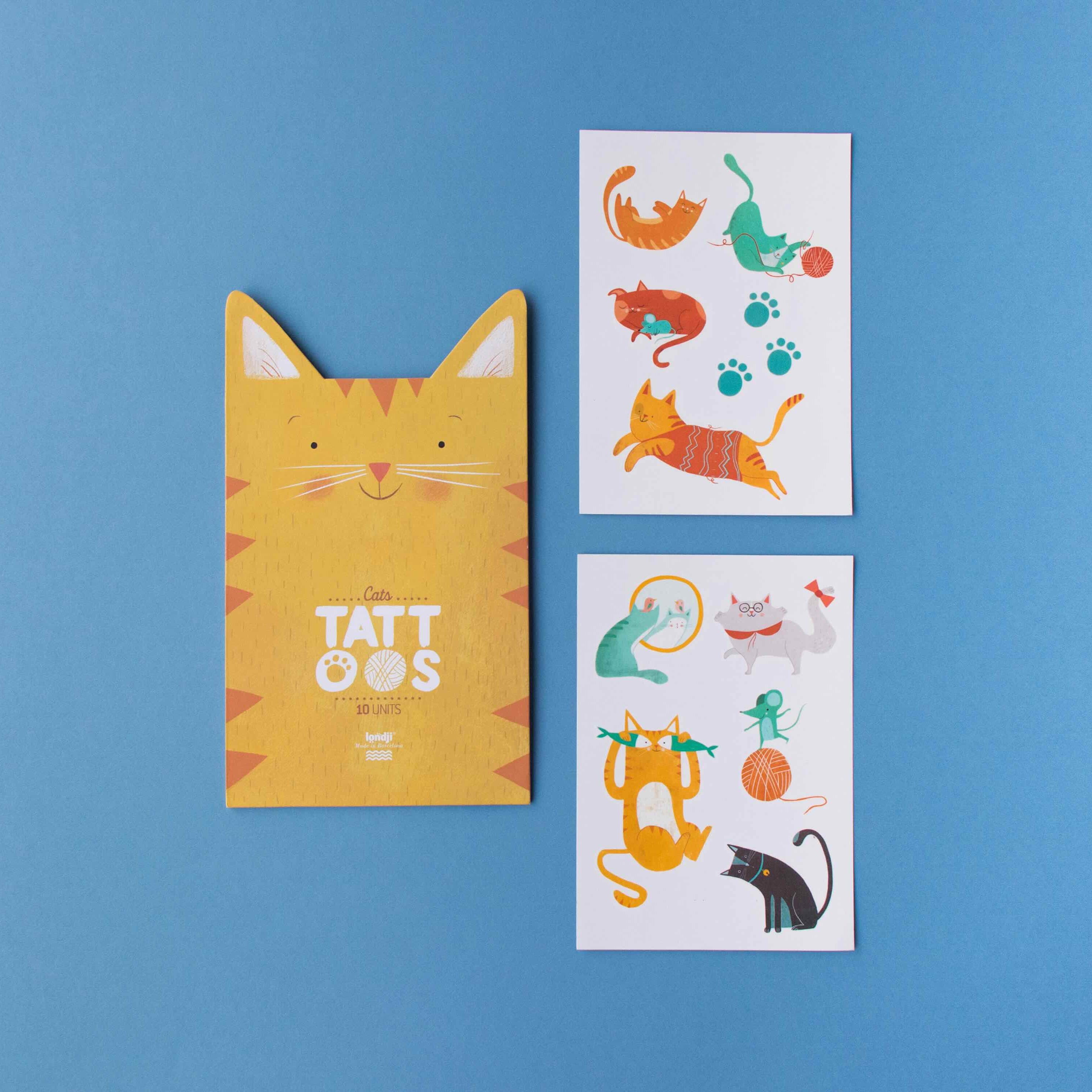 Londji yellow cat-shaped case with tattoos, and two sheets of cat-themed temporary tattoos on a blue background