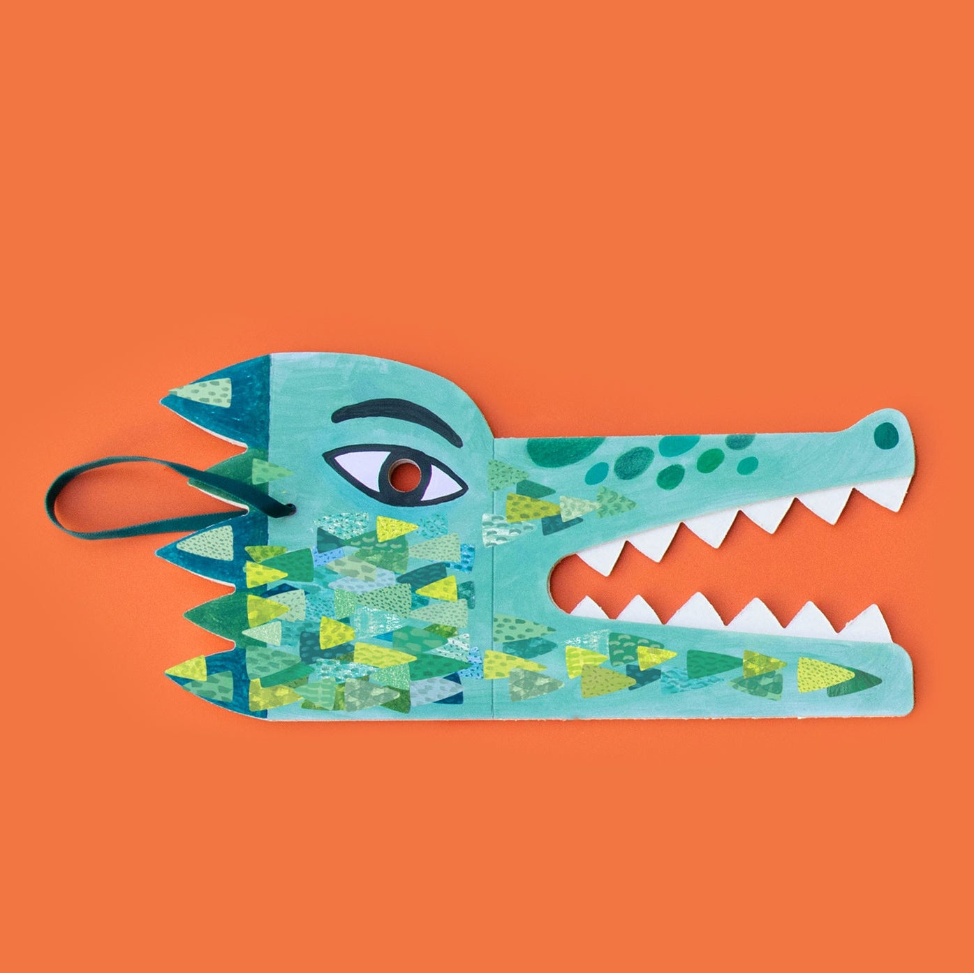 Londji colorful alligator mask on an orange background