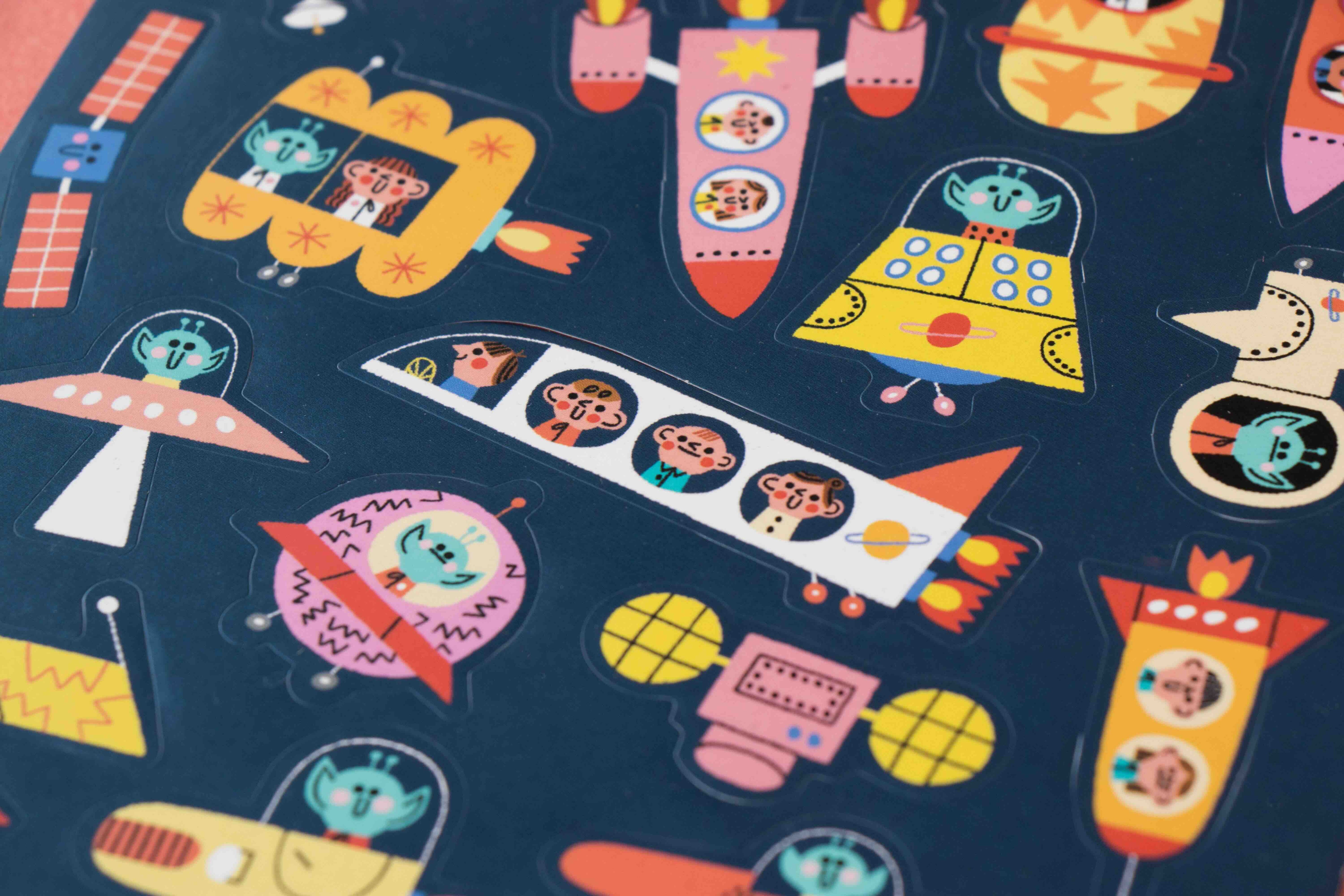 Londji colorful space-themed stickers on a dark blue background