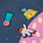 Londji colorful space-themed stickers on a pink and blue background
