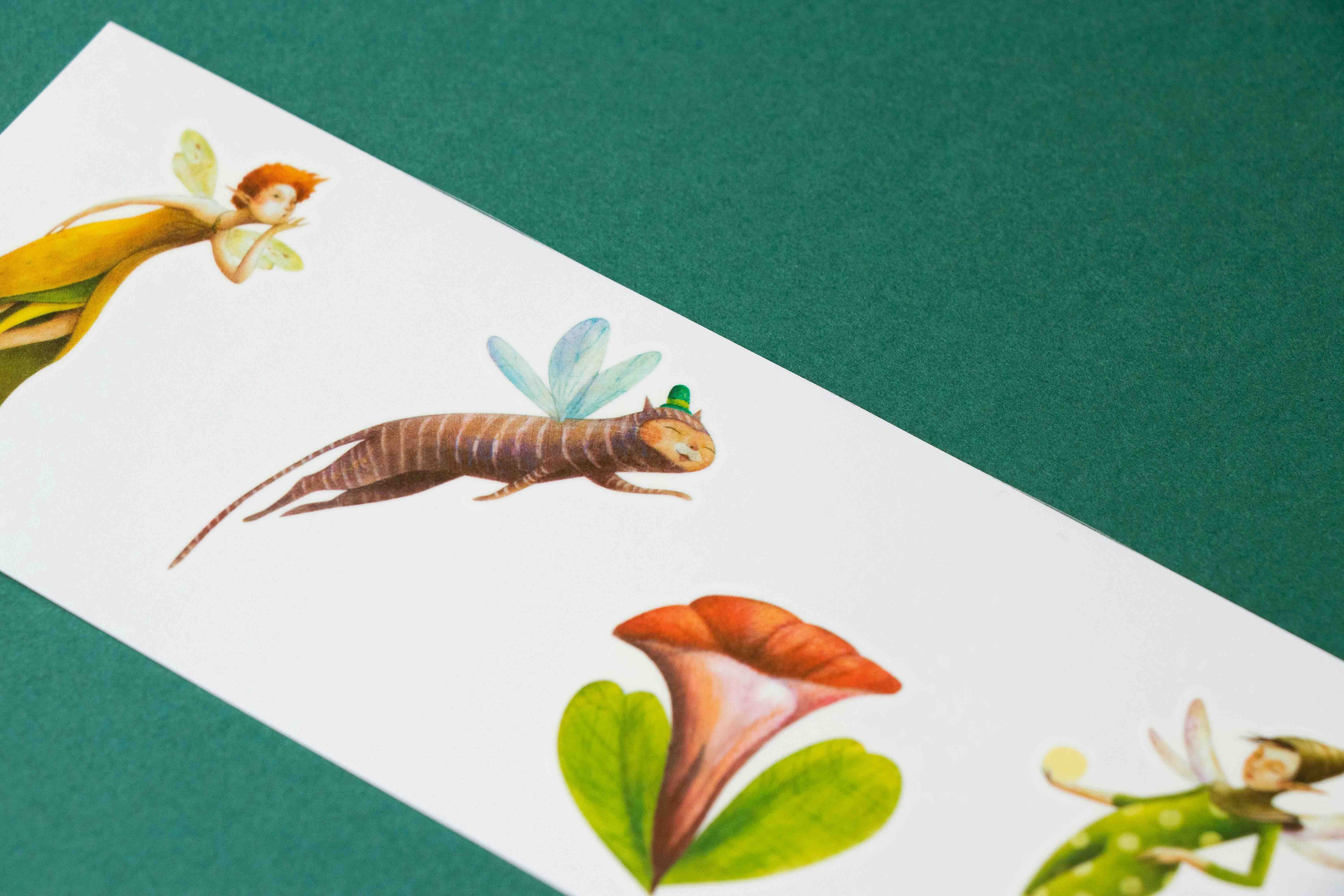 Londji illustrated fairy, dragonfly, and flowers on a white card with a green background