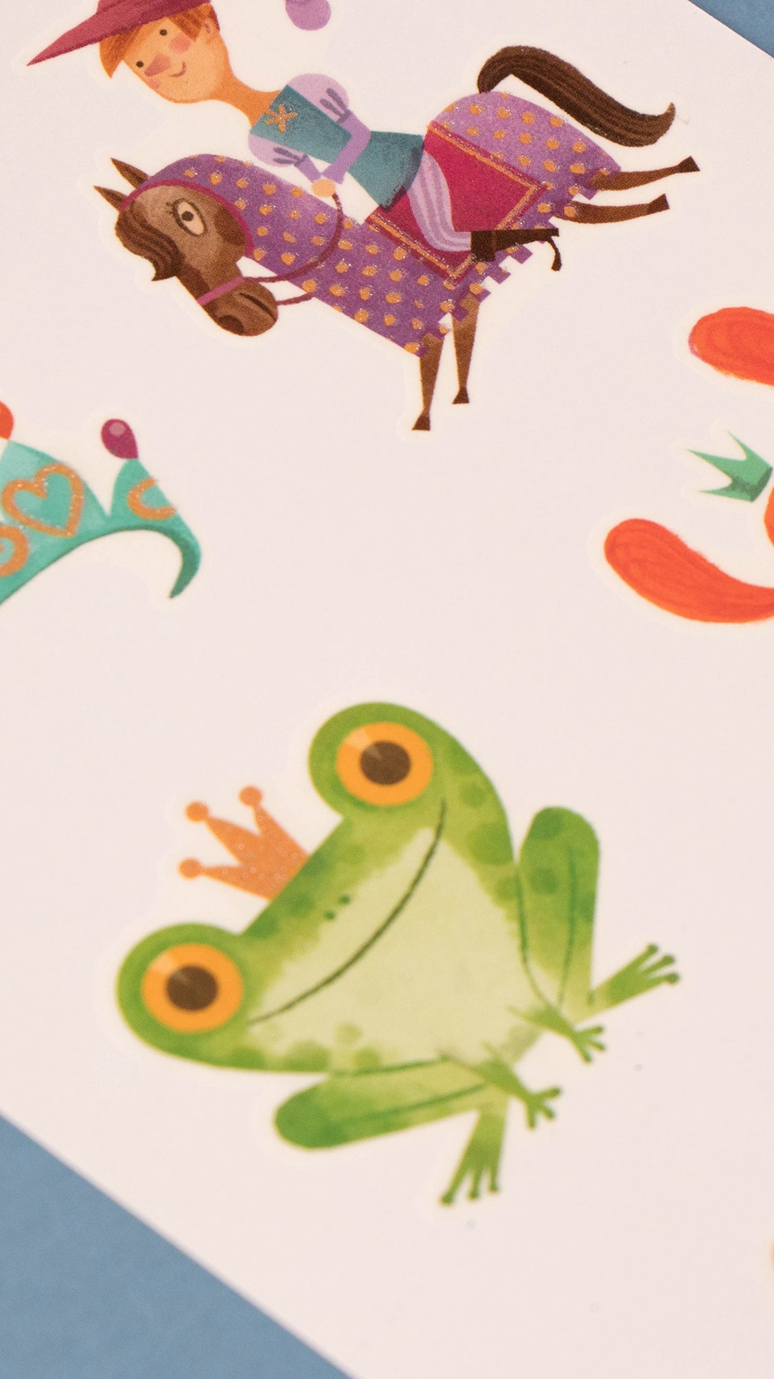 Londji colorful illustration of a frog with a crown, a horse, and a child on a white background.
