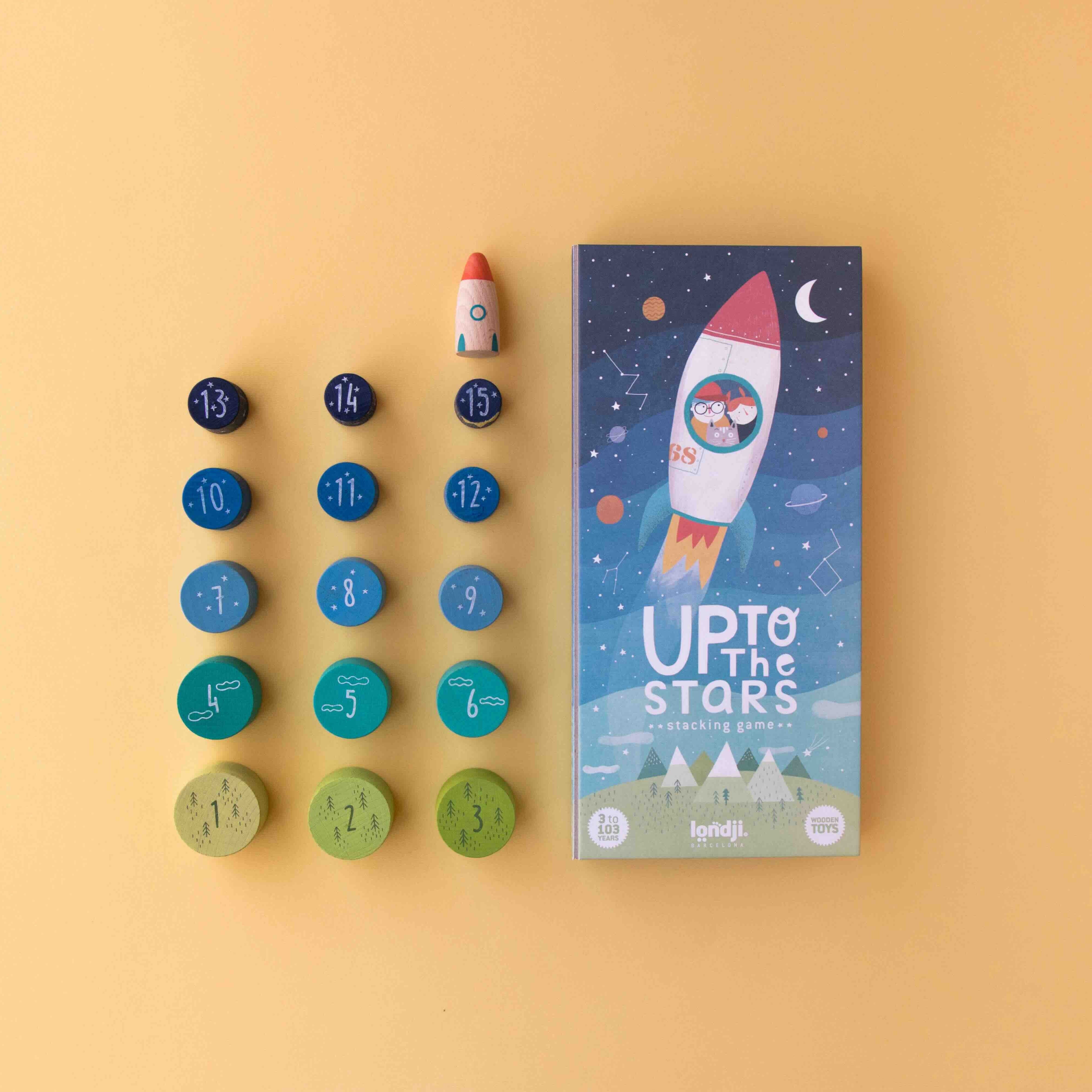 Londji wooden game packaging titled 'Up to the Stars' with colorful game pieces on a yellow background