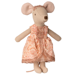 Stuffed mouse toy wearing a patterned dress on a white background