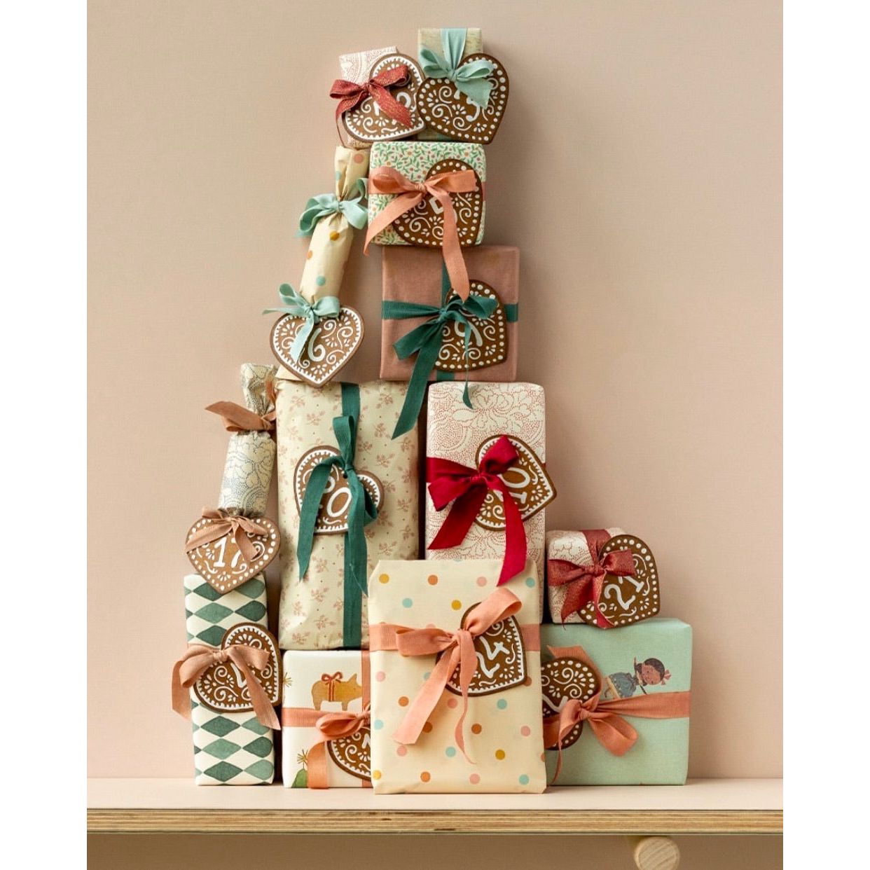 Maileg Calendar Tags, No. 1 to 24 Heart shaped tags on stack of beautifully wrapped gifts