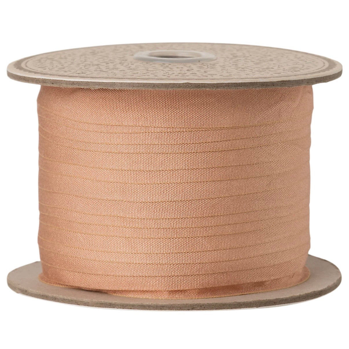 Spool of Maileg beige peach on a white background