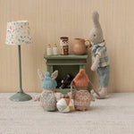 Maileg Winter Bunny Micro Brown & Rose sat around the Maileg fireplace with rabbit friends
