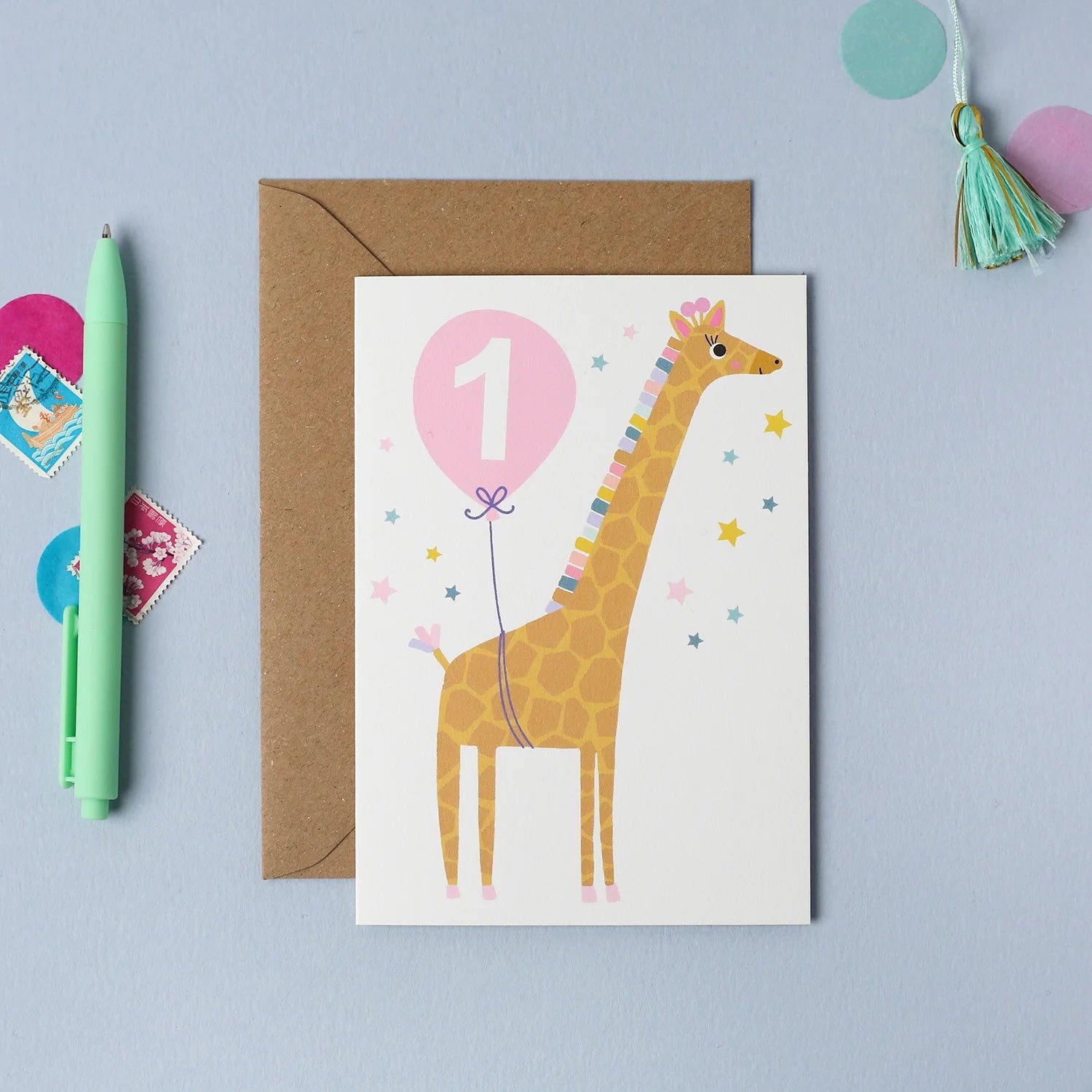 Mifkins birthday card with a giraffe and number one balloon on a blue background