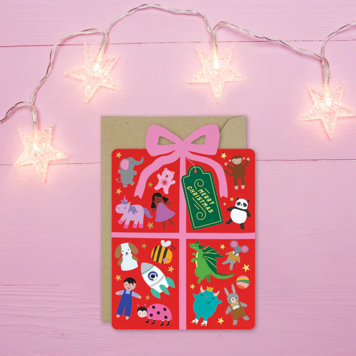 Mifkins Christmas card with cartoon characters on a pink background with string lights.