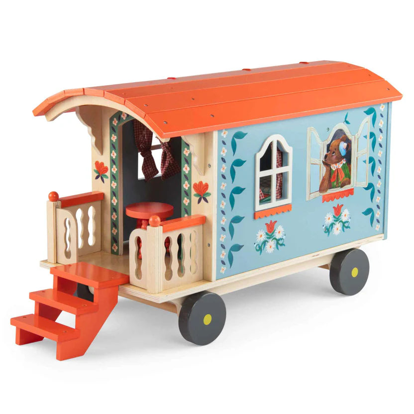 Moulin Roty colourful toy caravan with floral design on a white background