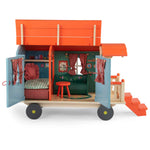 Moulin Roty toy caravan with interior details on a white background