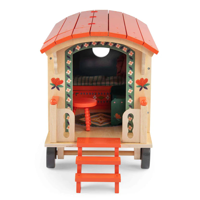 Moulin Roty wooden playhouse with red roof and steps on a white background