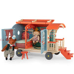 Moulin Roty toy caravan with teddy bear figures on a white background