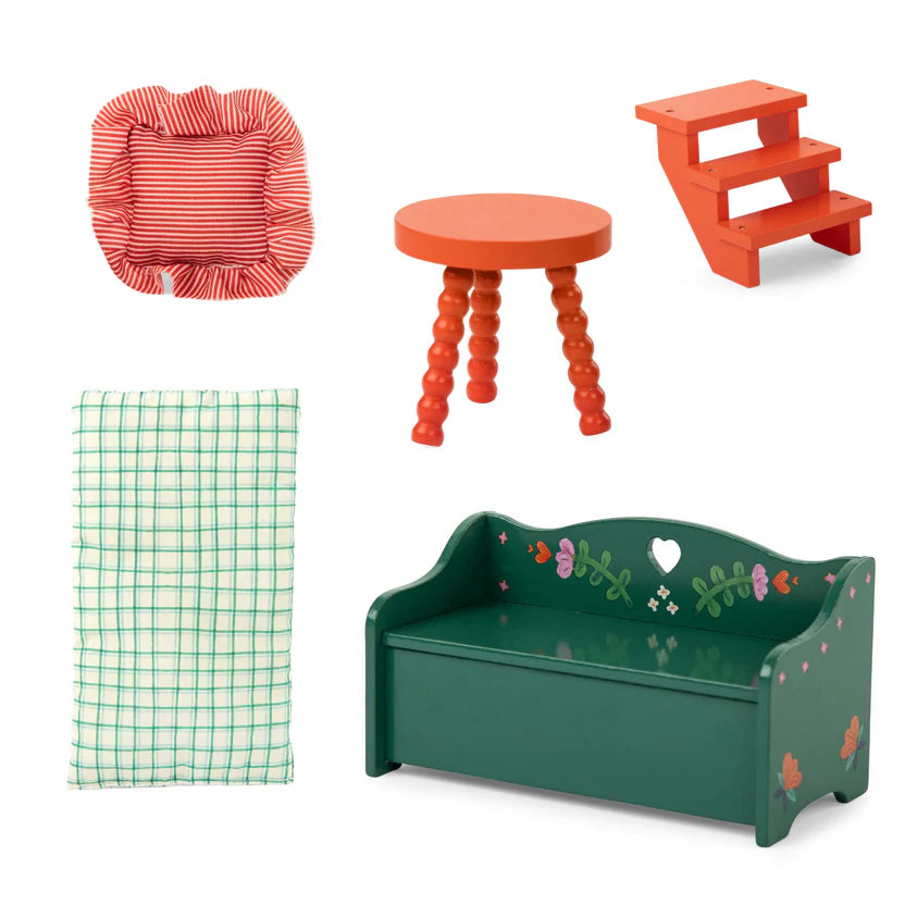 Collection of colourful furniture for toy caravan and accessories on a white background