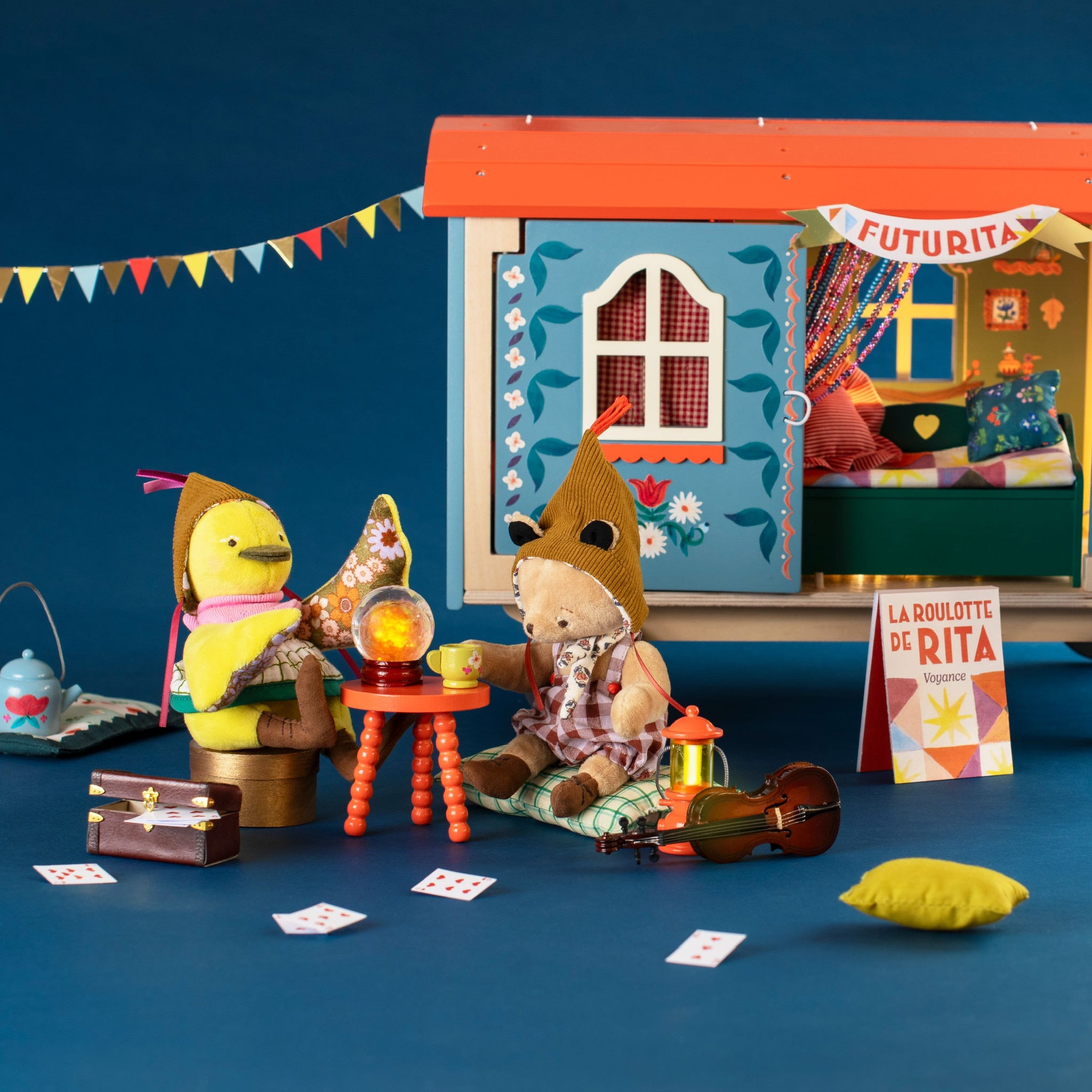 Moulin Roty toy scene with a duck, teddy bear, and other toys 