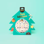 Packaging of OMY face stickers with a Christmas tree design on a light blue background