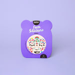 Purple packaging of OMY face stickers with a colorful sticker design on a light purple background
