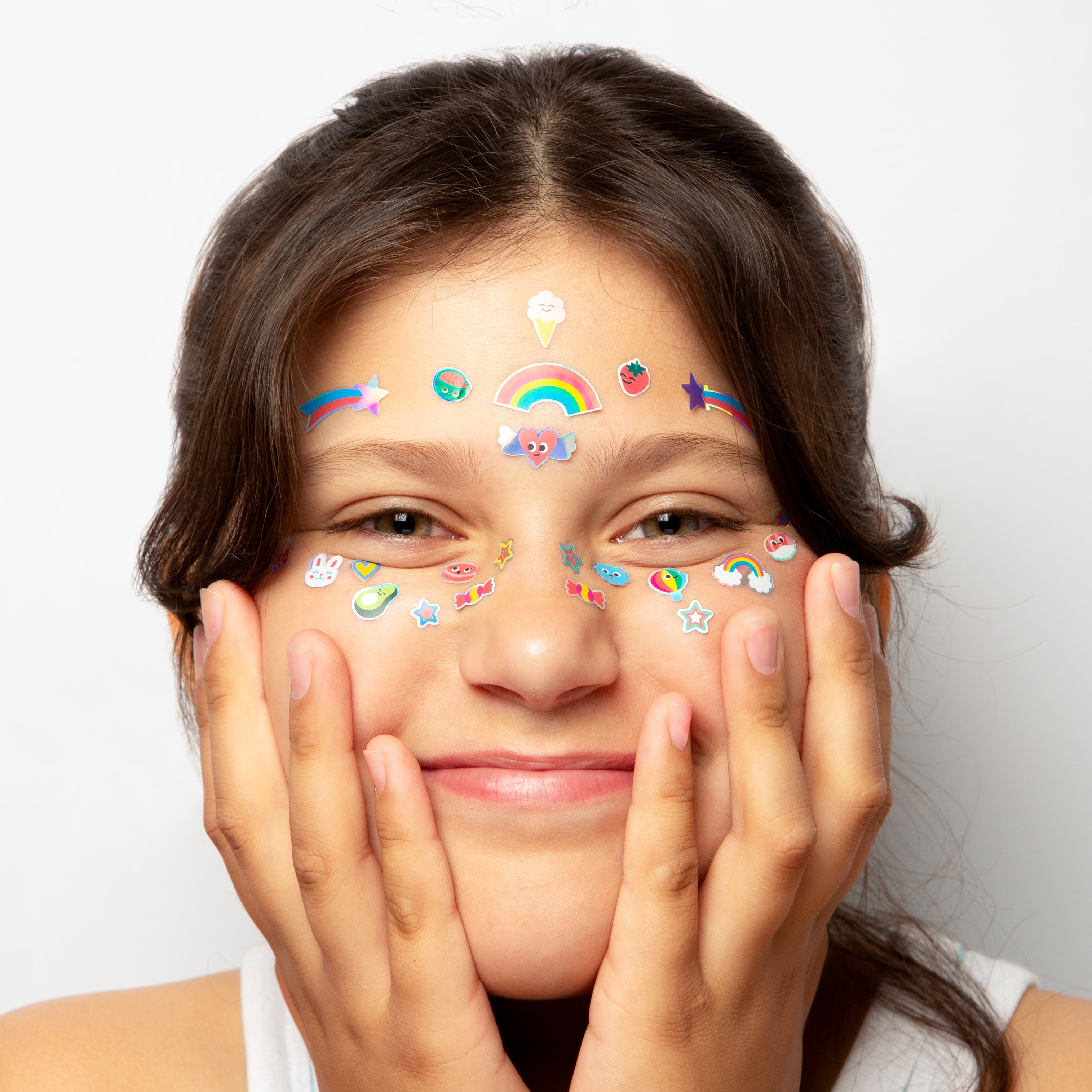 Girl with colorful OMY face stickers on a white background