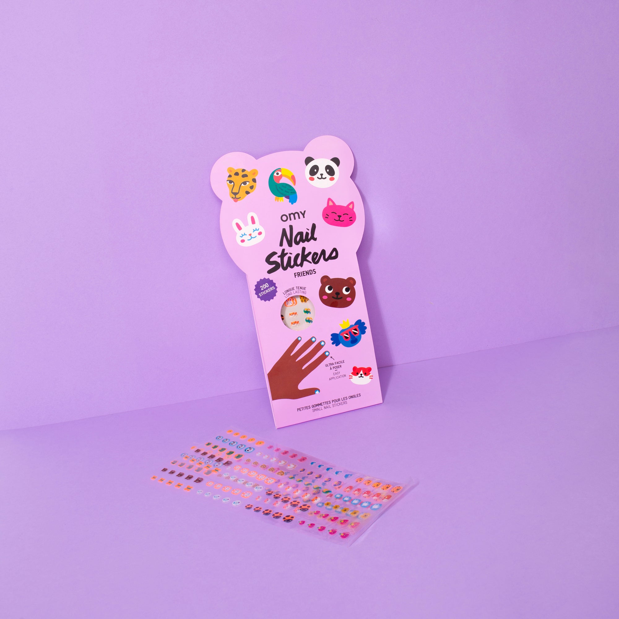 Pack of OMY nail stickers with colorful designs on a purple background