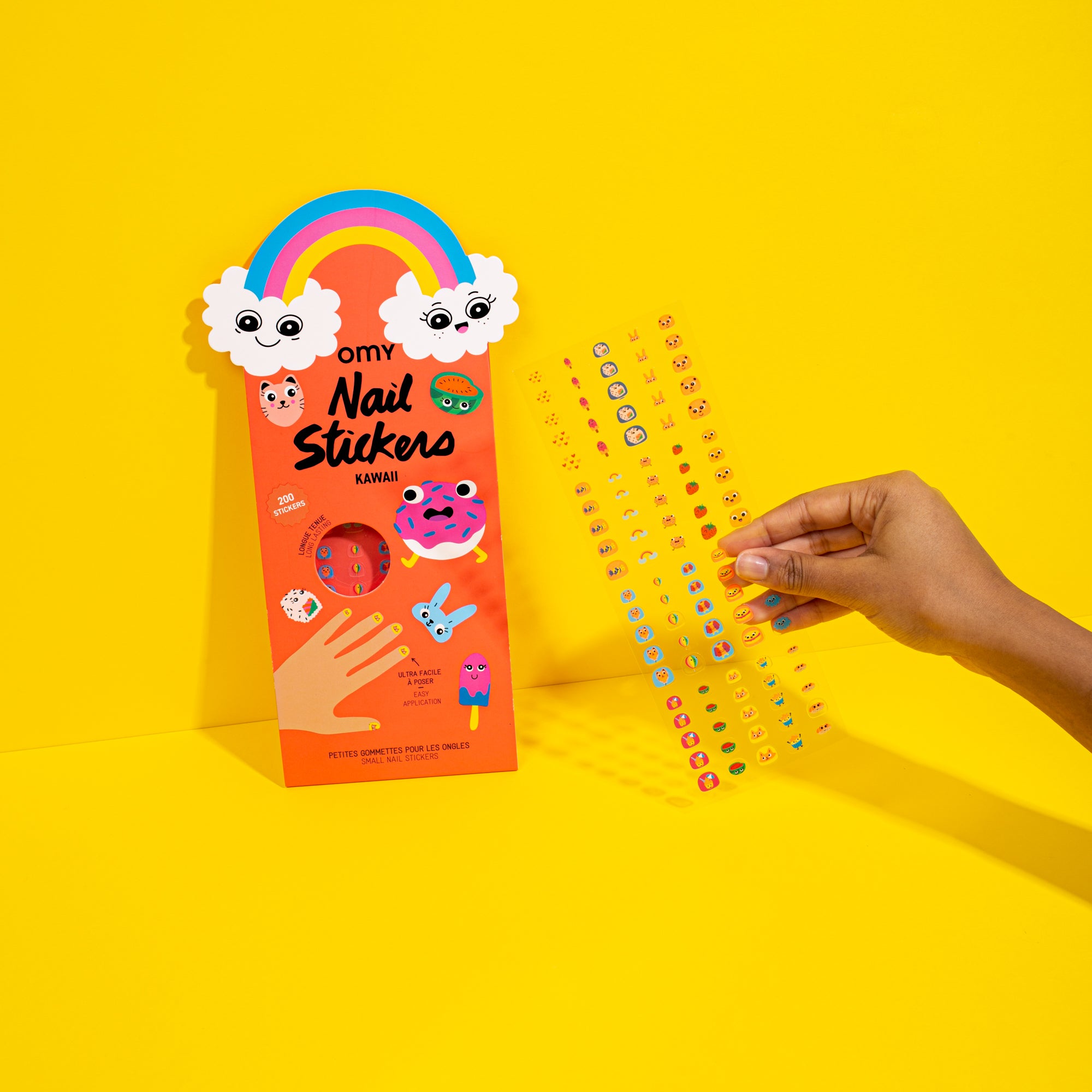 Nail OMY sticker set with packaging on a yellow background
