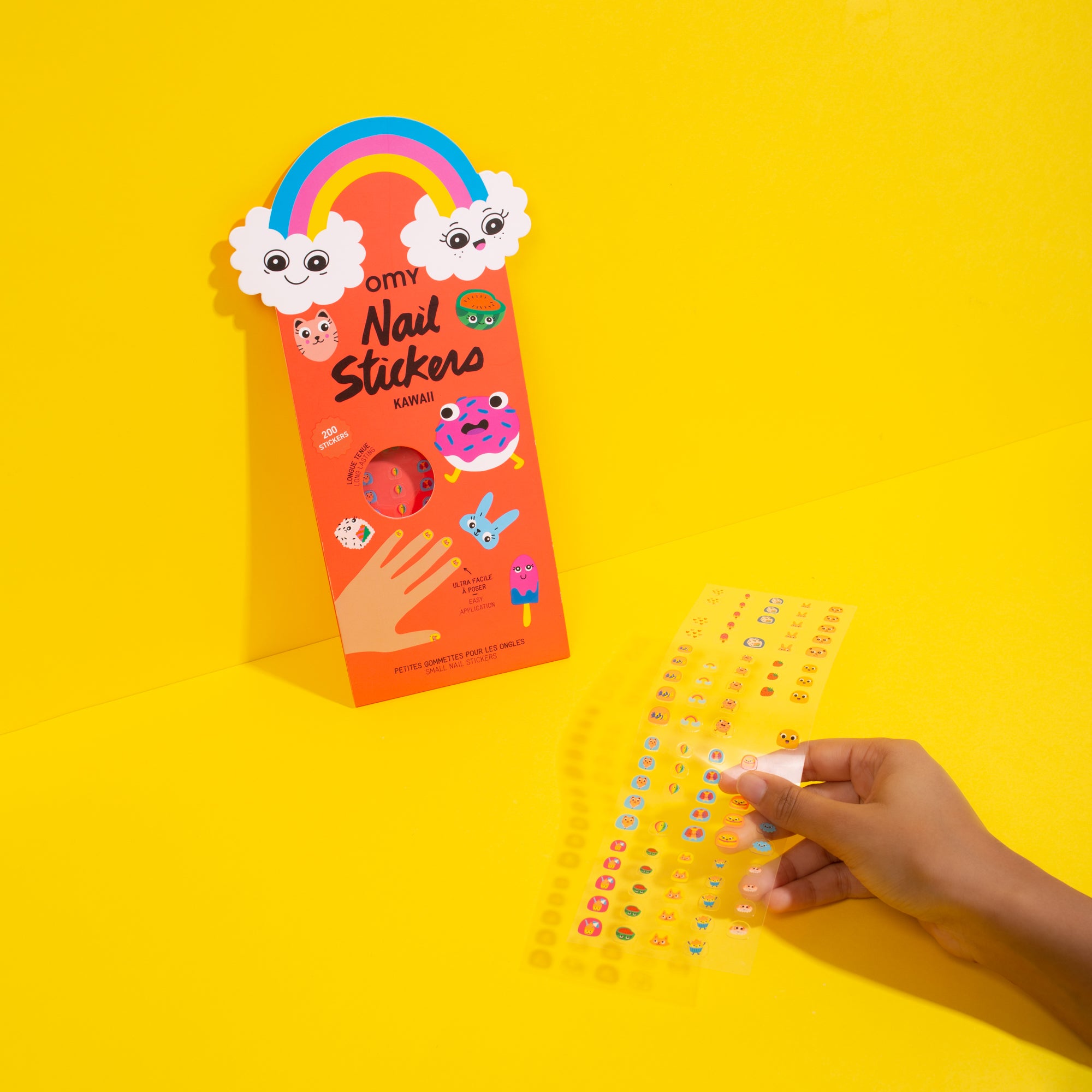 OMY nail sticker package with colorful design on a yellow background