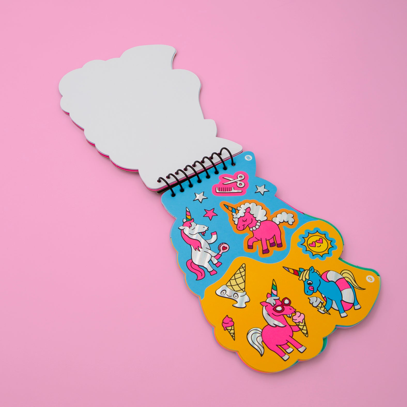 OMY children's activity book with colorful stickers on a pink background