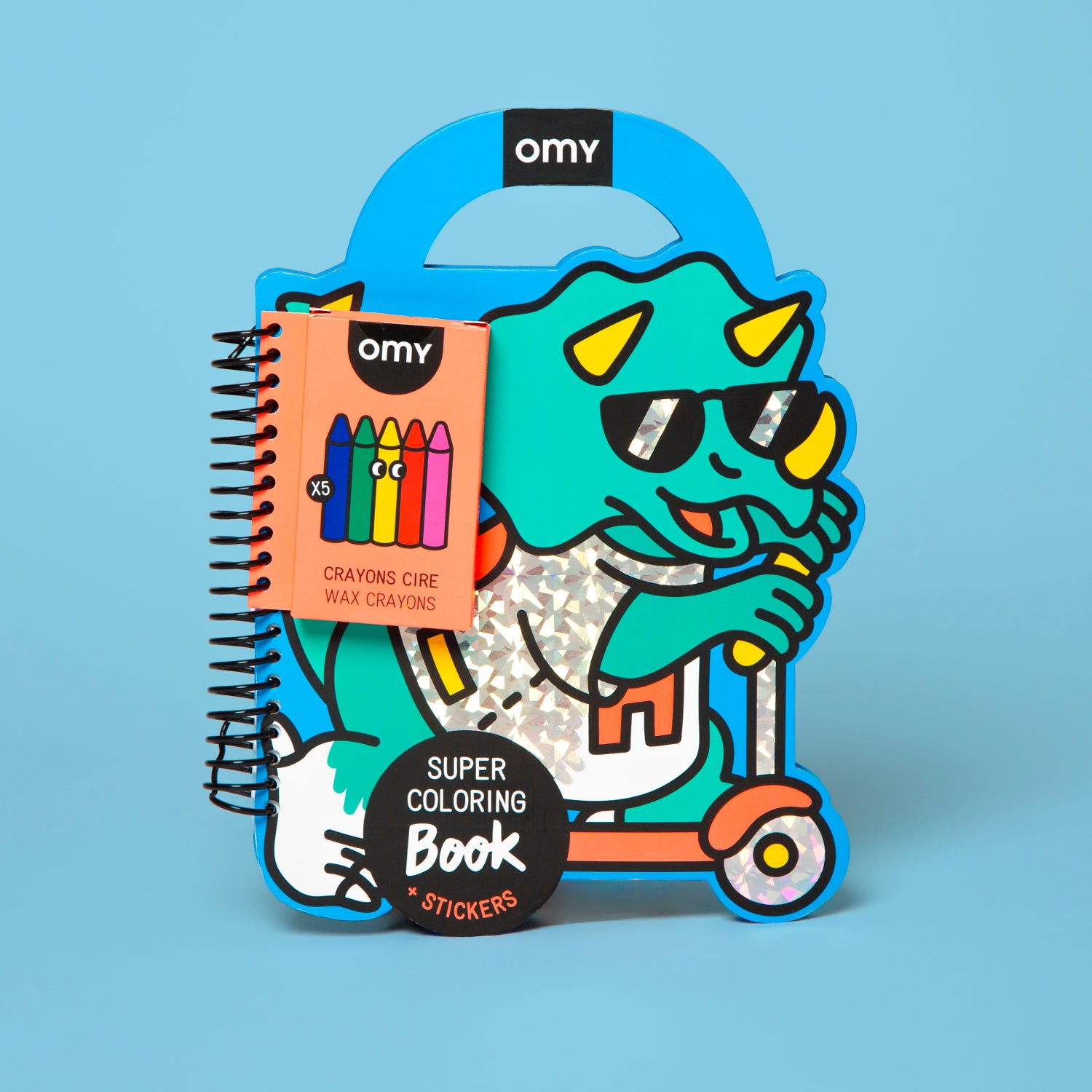 Colorful OMY packaging of a coloring book and crayons with a cartoon character on a blue background