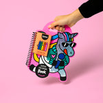 OMY coloring book and crayons set with a unicorn design on a pink background