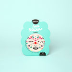 Pack of OMY face stickers with a floral design on a light green background